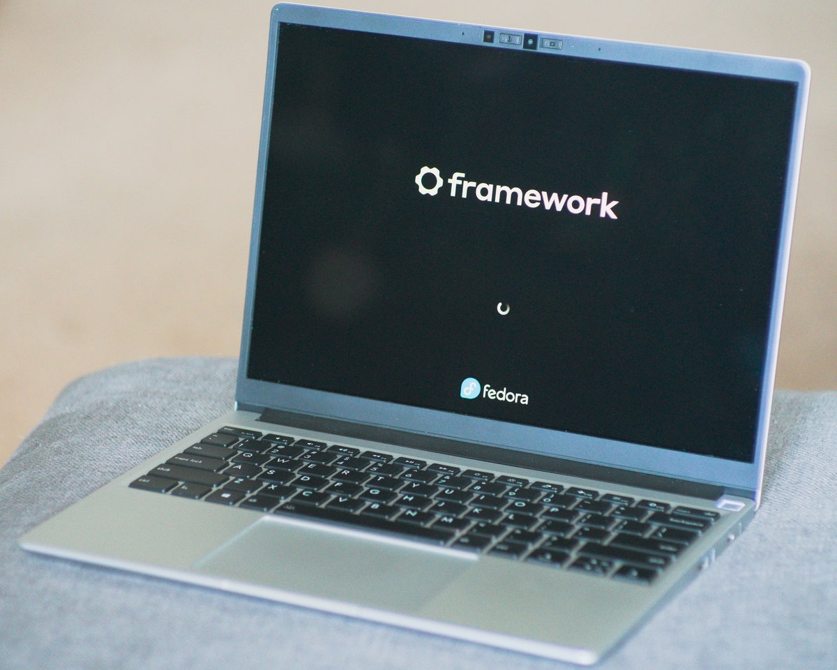 My Framework laptop looking majestic and showing the Fedora boot screen.
